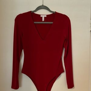 Leigh Bodysuit. Red. Long sleeve. Snap bottom-thong.